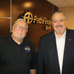 James Dowd, Pathfinder Bank President and CEO, presents a check representing the bank’s support of Harborfest’s annual fireworks display to Dan Harrington, Harborfest Executive Director.
