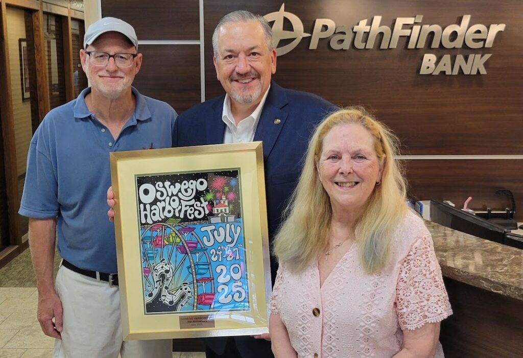 Pathfinder Bank President and CEO James Dowd, center, receives Harborfest’s annual poster from Board of Directors President Chuck Handley, left, and Harborfest Marketing and Membership Coordinator Carol Dillabough, at right.